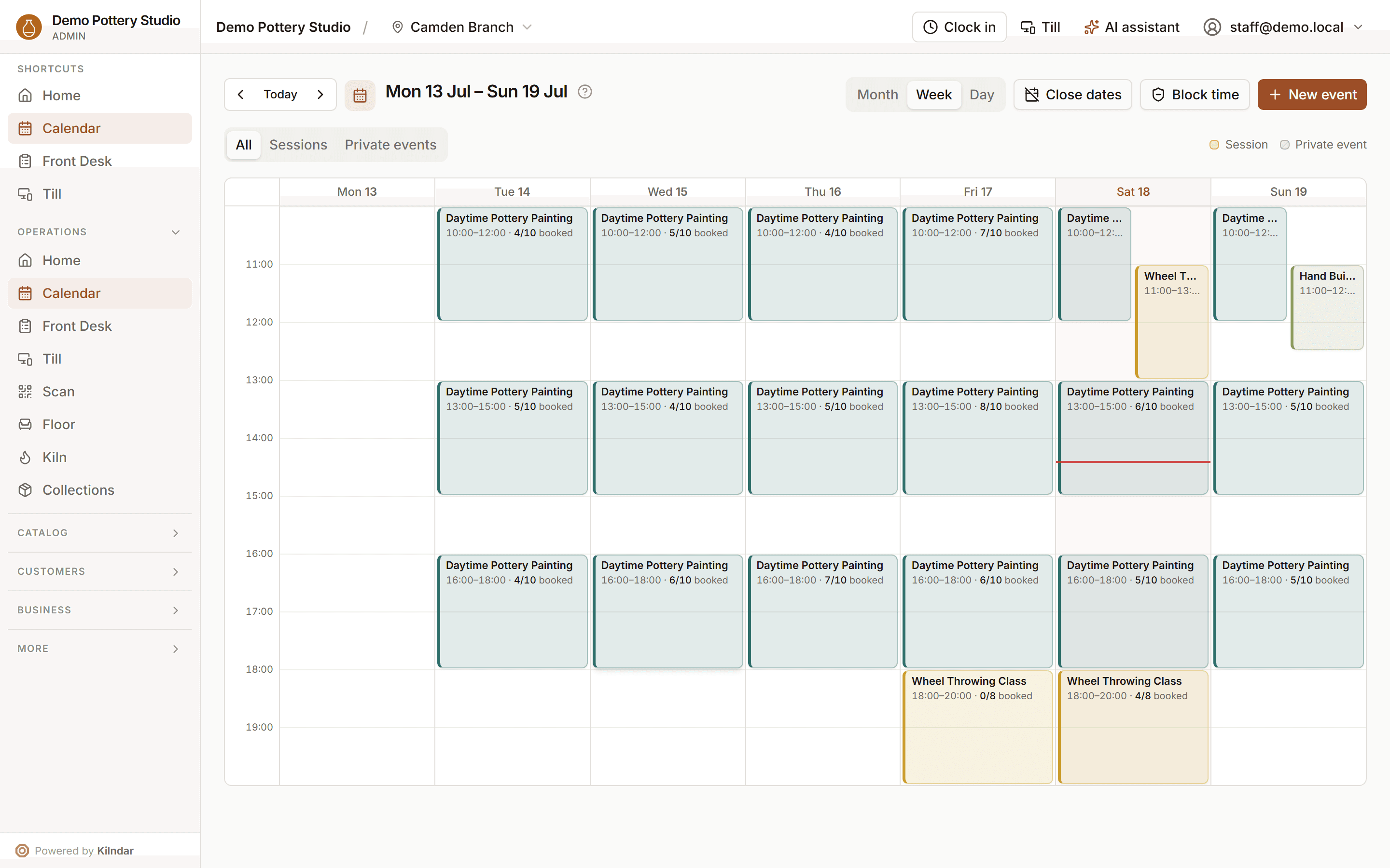 The operations calendar in week view: daytime painting sessions, evening wheel classes and hand building workshops, each with live booked counts