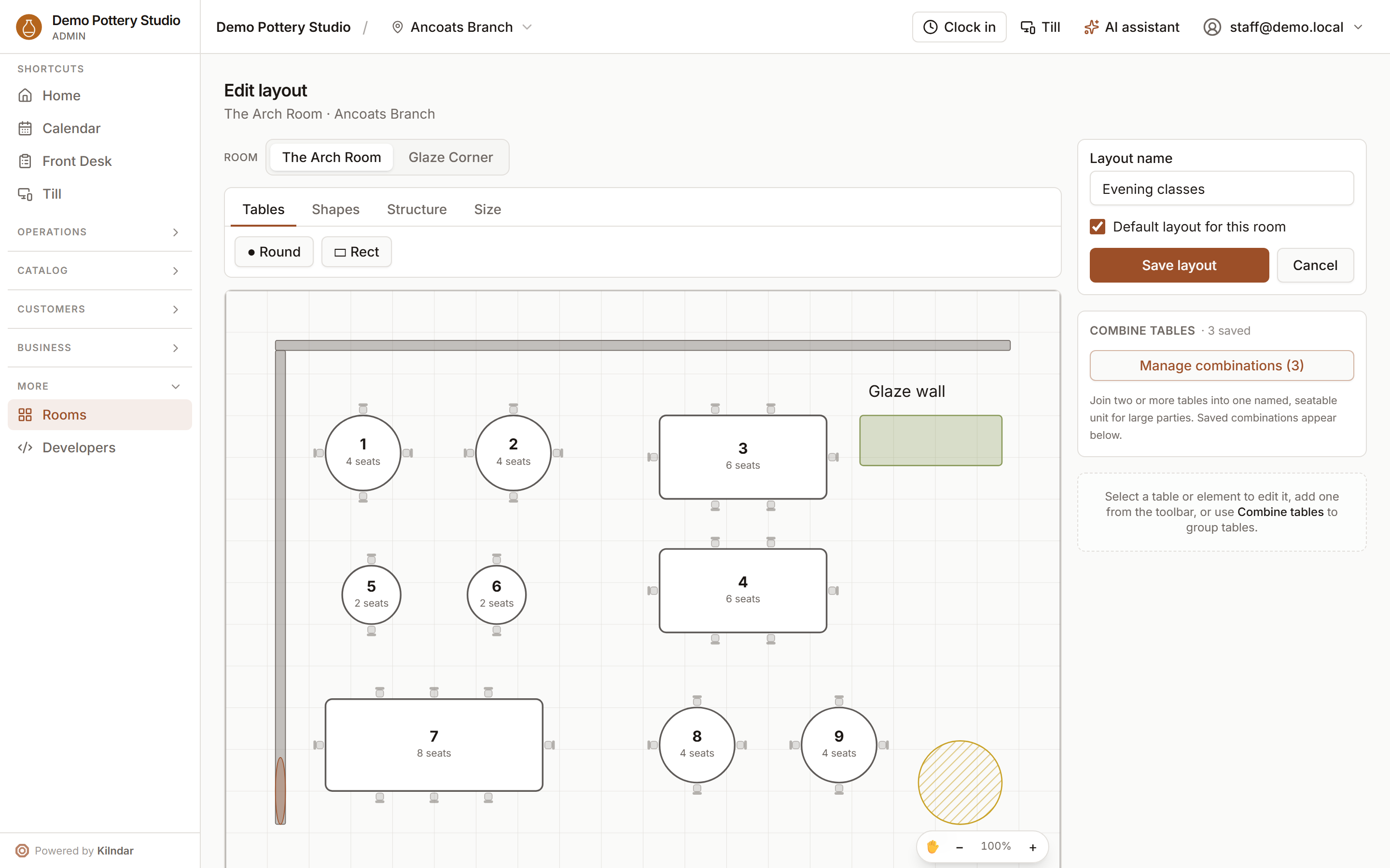 The floor layout editor with tables, chairs, a glaze wall and the kiln